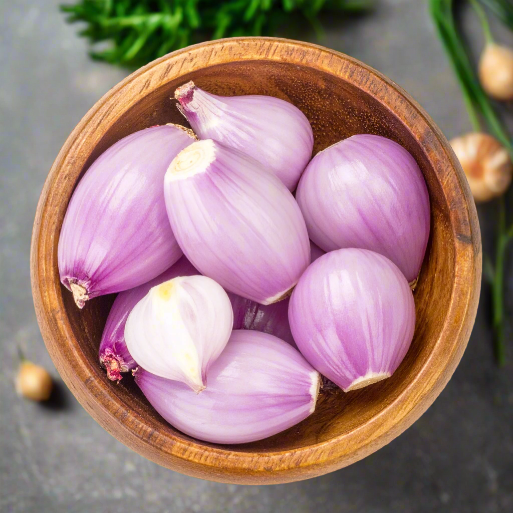 Peeled Shallots in a wooden bowl